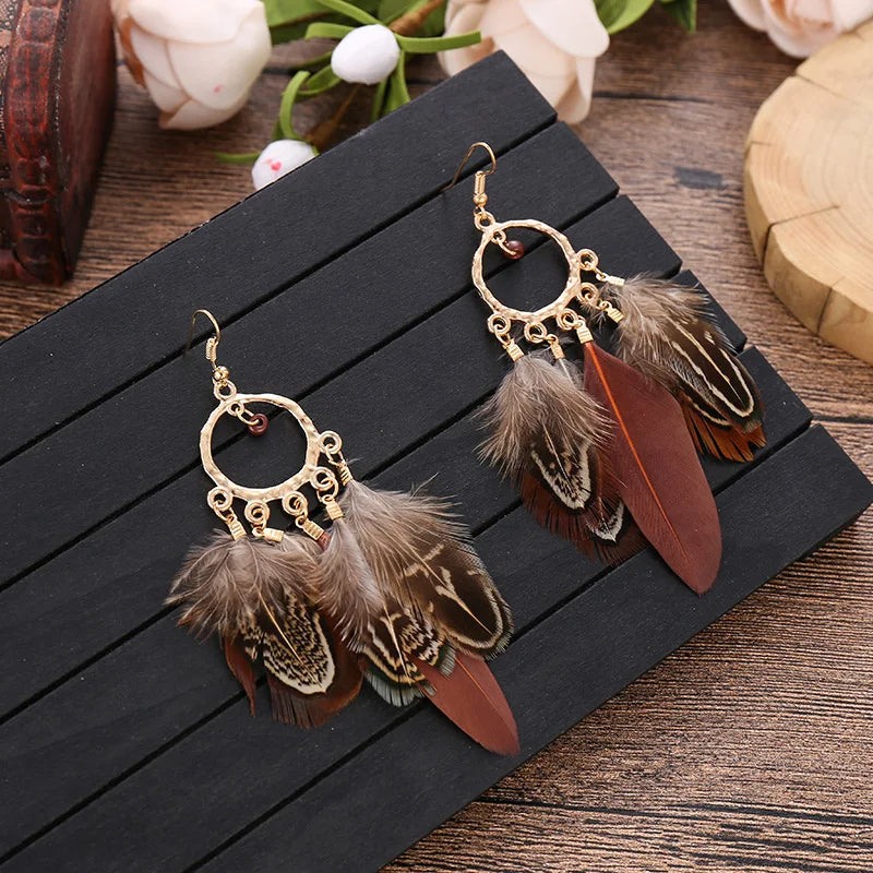 Feather dangle earrings styled for boho western coastal cowgirl outfits
