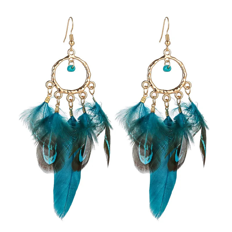 Feather dangle earrings styled for boho western coastal cowgirl outfits
