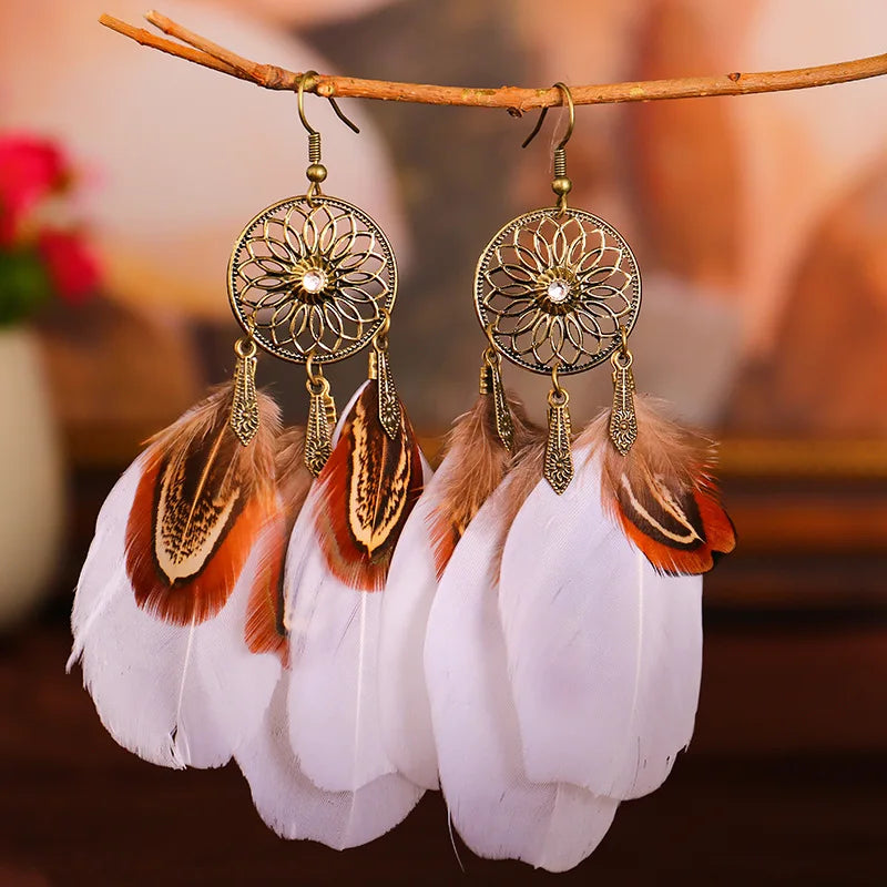 Feather dangle earrings styled for boho western coastal cowgirl outfits
