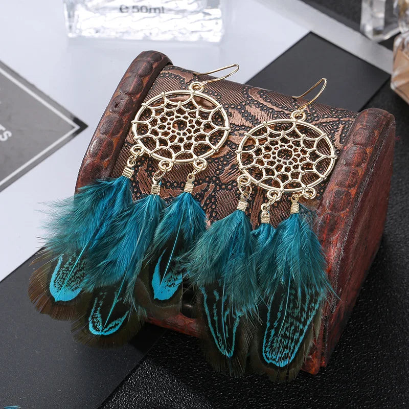 Feather dangle earrings styled for boho western coastal cowgirl outfits