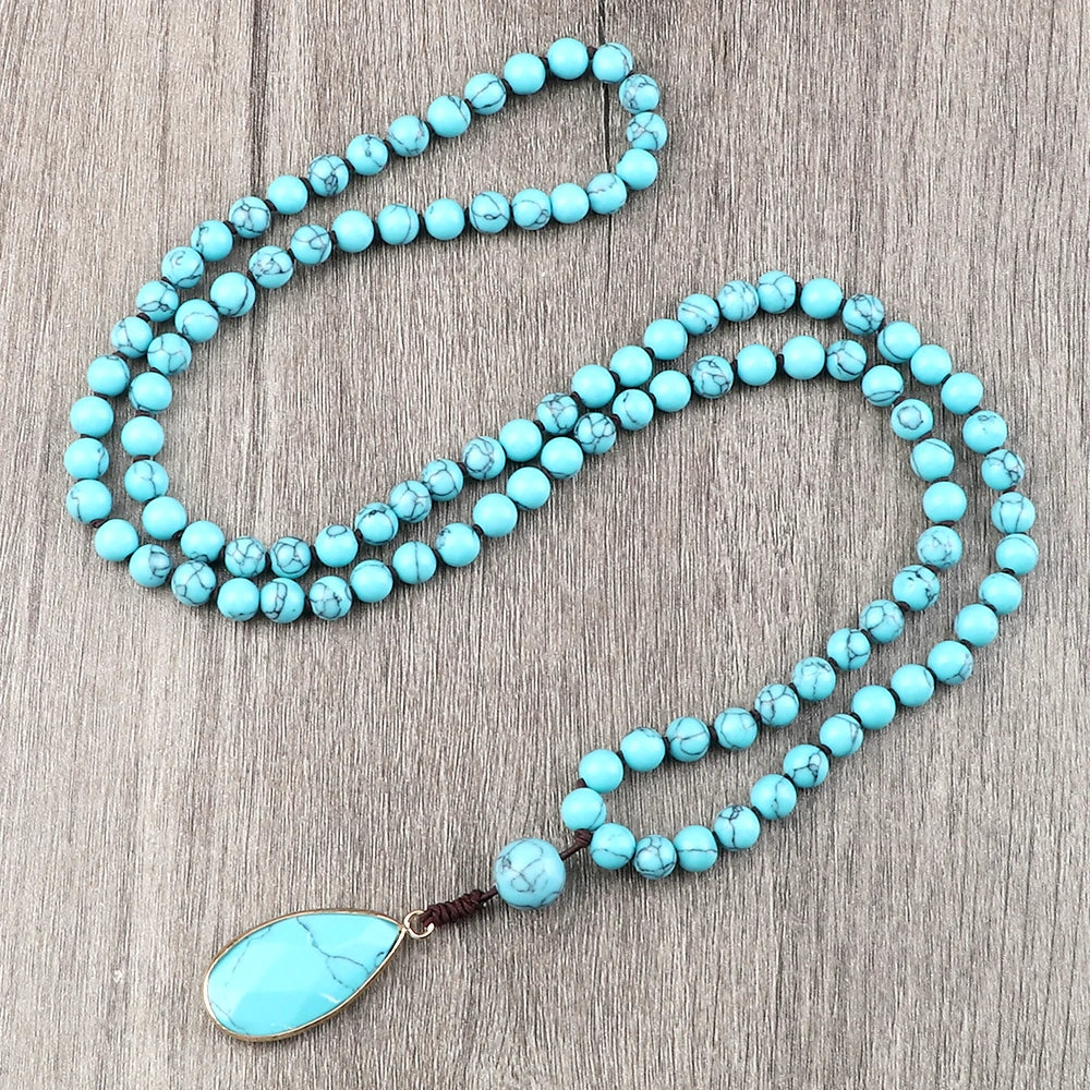 Blue bead necklace with water-drop pendant look for coastal cowgirl styling