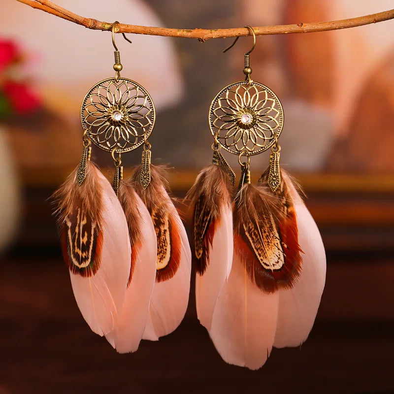 Feather dangle earrings styled for boho western coastal cowgirl outfits