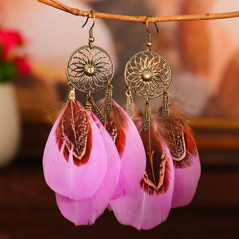 Feather dangle earrings styled for boho western coastal cowgirl outfits