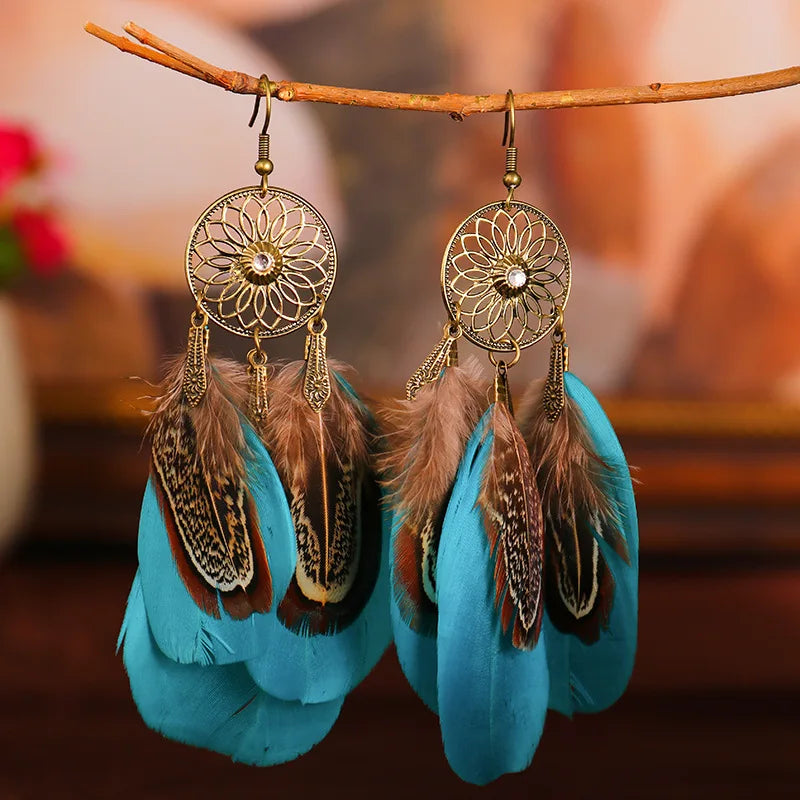 Feather dangle earrings styled for boho western coastal cowgirl outfits