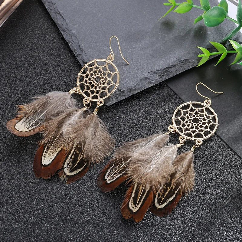 Feather dangle earrings styled for boho western coastal cowgirl outfits