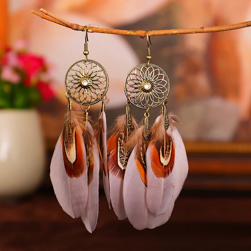 Feather dangle earrings styled for boho western coastal cowgirl outfits