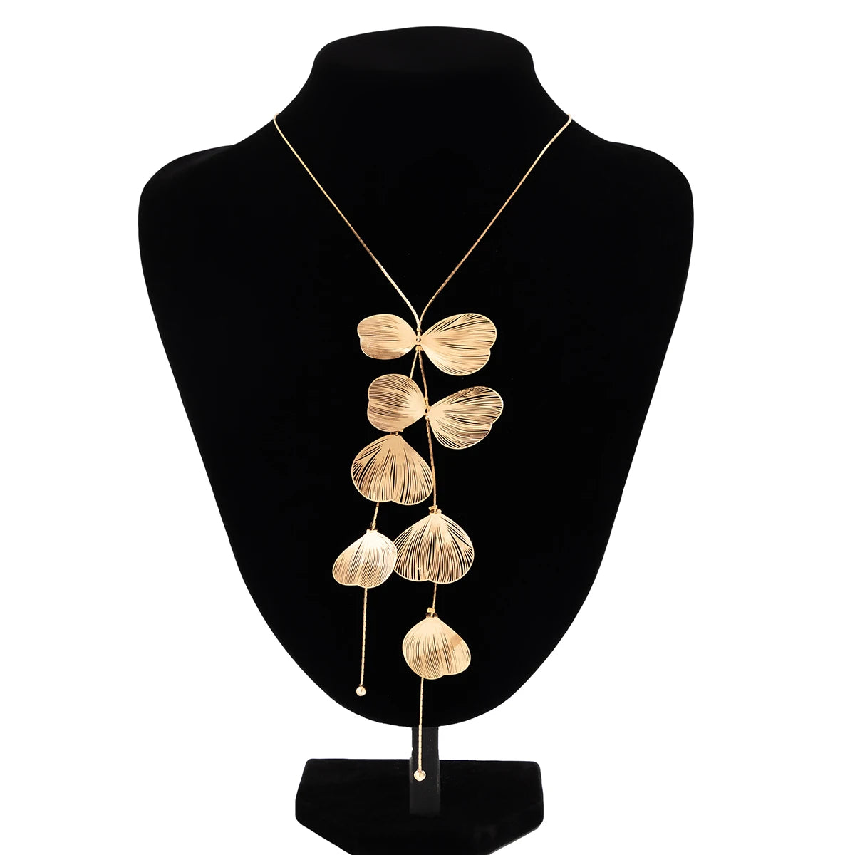 Gold shell design lariat necklace styled for coastal cowgirl beach outfits