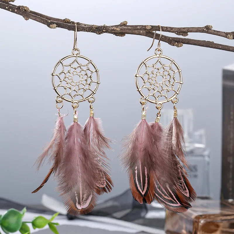 Feather dangle earrings styled for boho western coastal cowgirl outfits