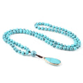 Blue bead necklace with water-drop pendant look for coastal cowgirl styling