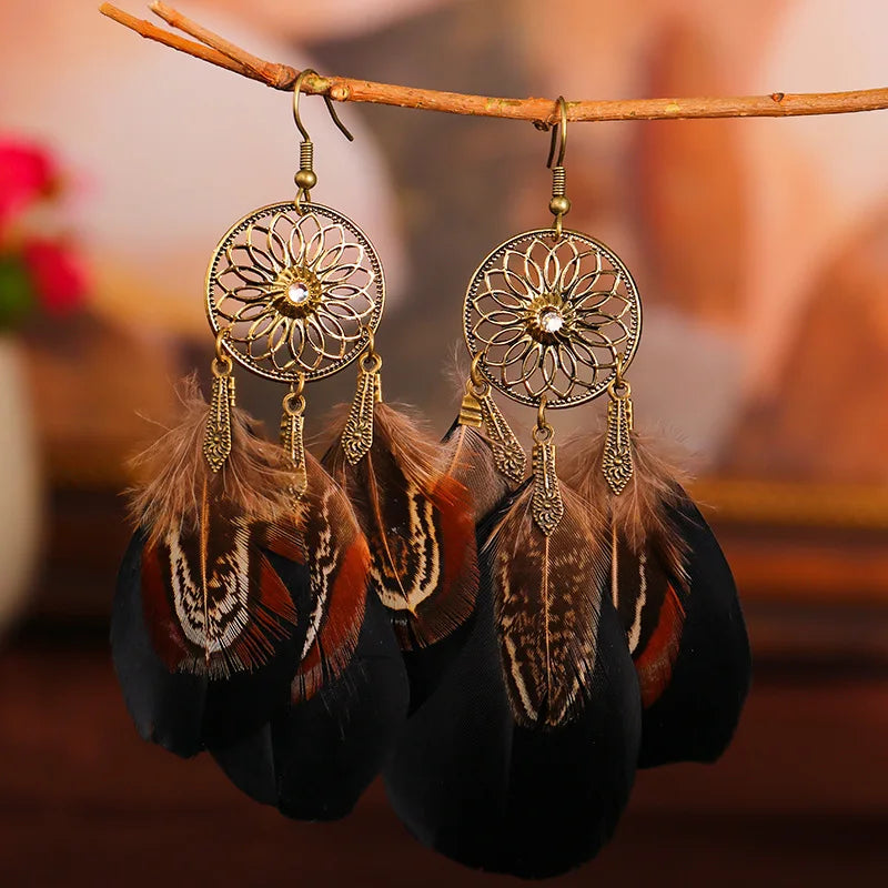 Feather dangle earrings styled for boho western coastal cowgirl outfits