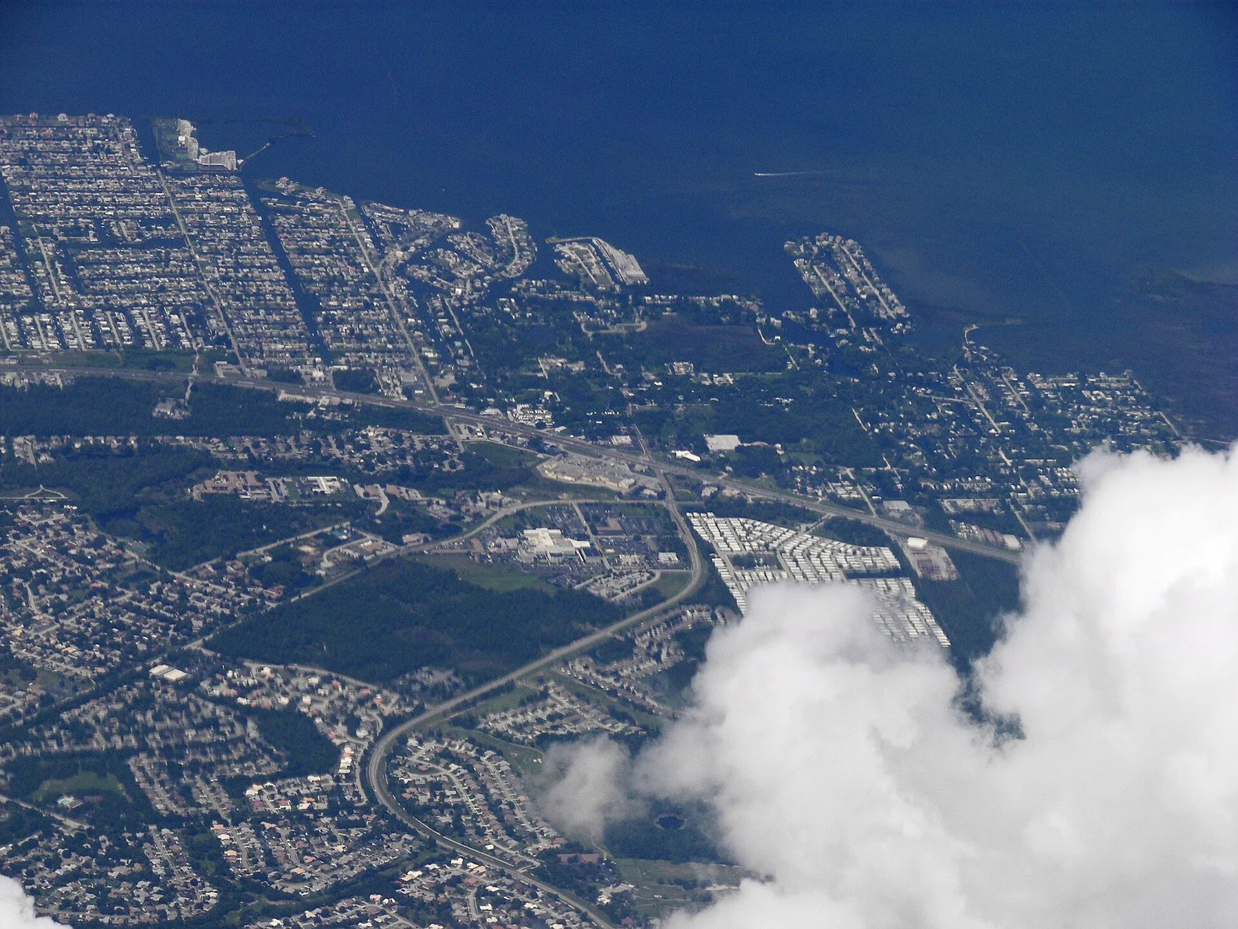 Aerial view of Hudson and Hudson Beach where neighborhood canals meet the Gulf of Mexico