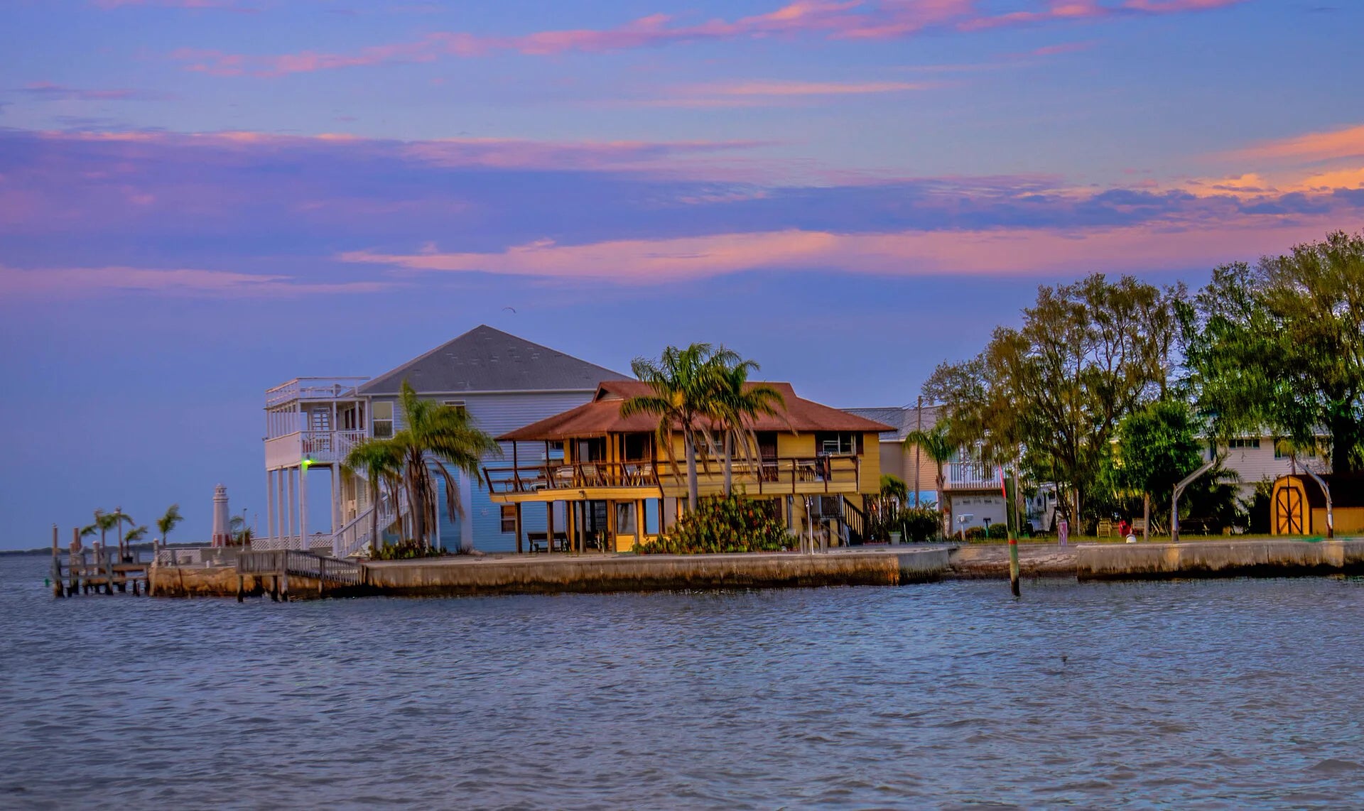 Pastel evening sky over waterfront homes in Hudson Beach, Florida